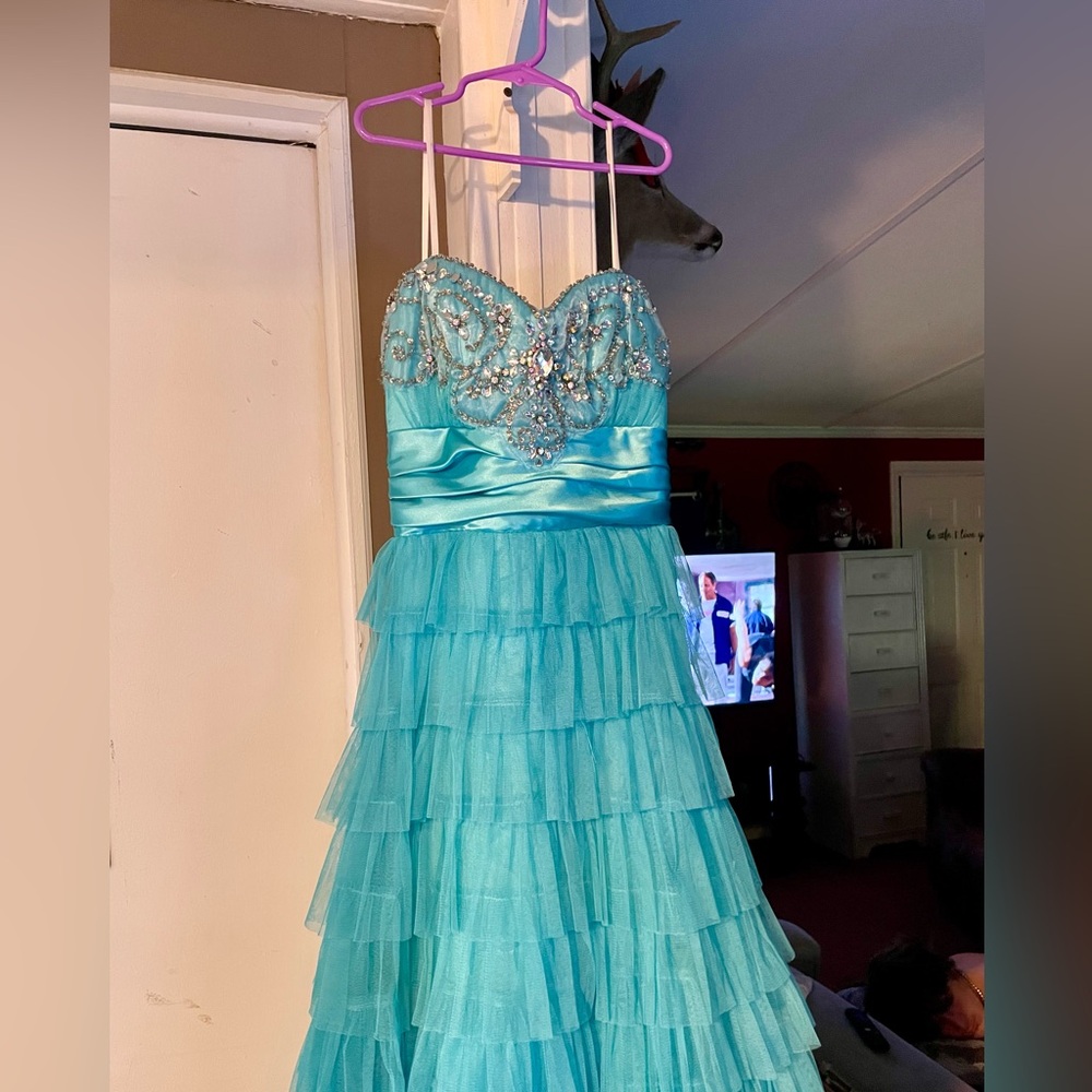 Turquoise prom dress with jewels.